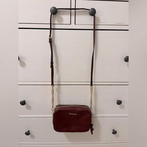 Michael Kors crossbody bag. Maroon colored. New.